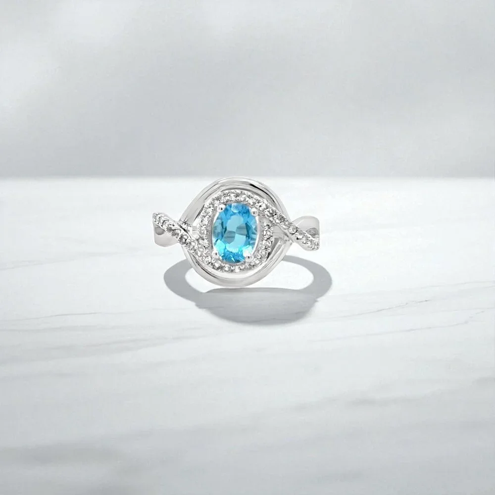 Silver Ring with Bright Blue Gemstone and Halo Accents